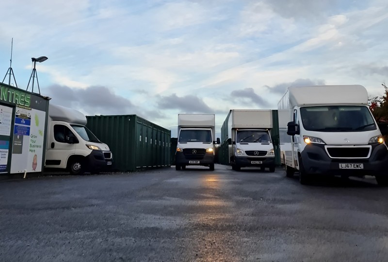 Gibbons Removals fleet of vans parked up waiting for a house clearance