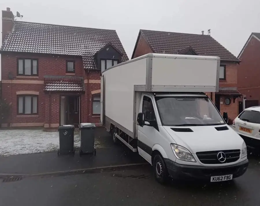 Gibbons Removals team carefully packing items in a Rhyl home