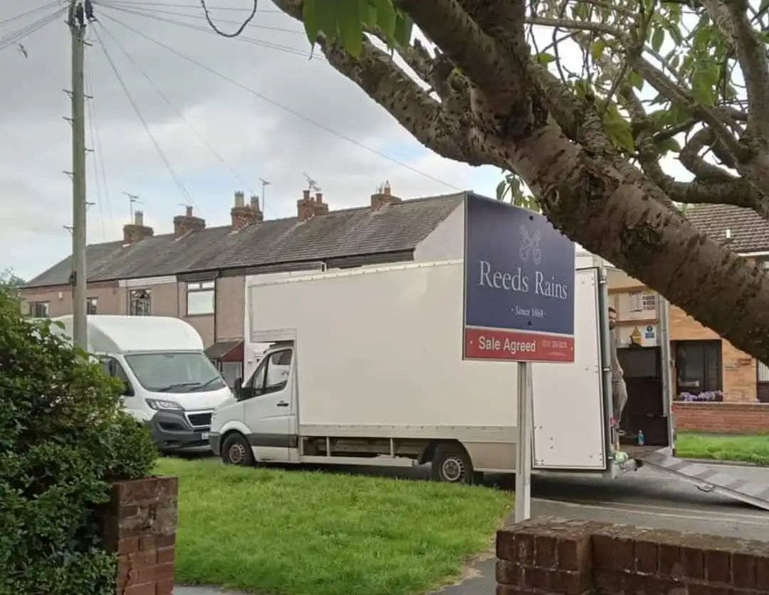 Gibbons Removals vans in Caldy village